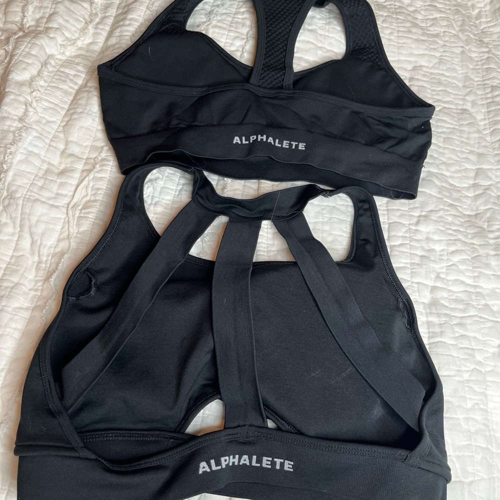 Two alphalete sports bras size large like new perfect condition.